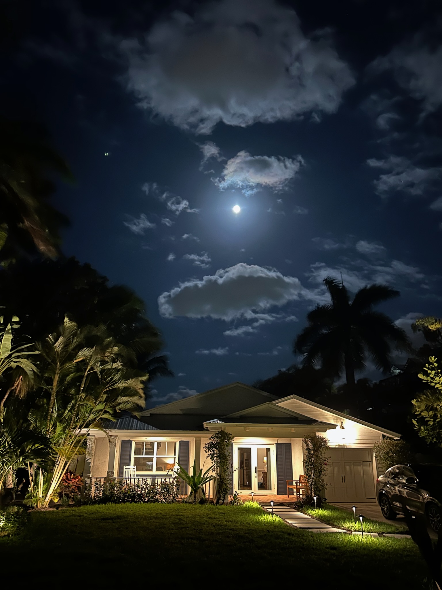 Lionfish Cottage illuminated beneath the evening sky